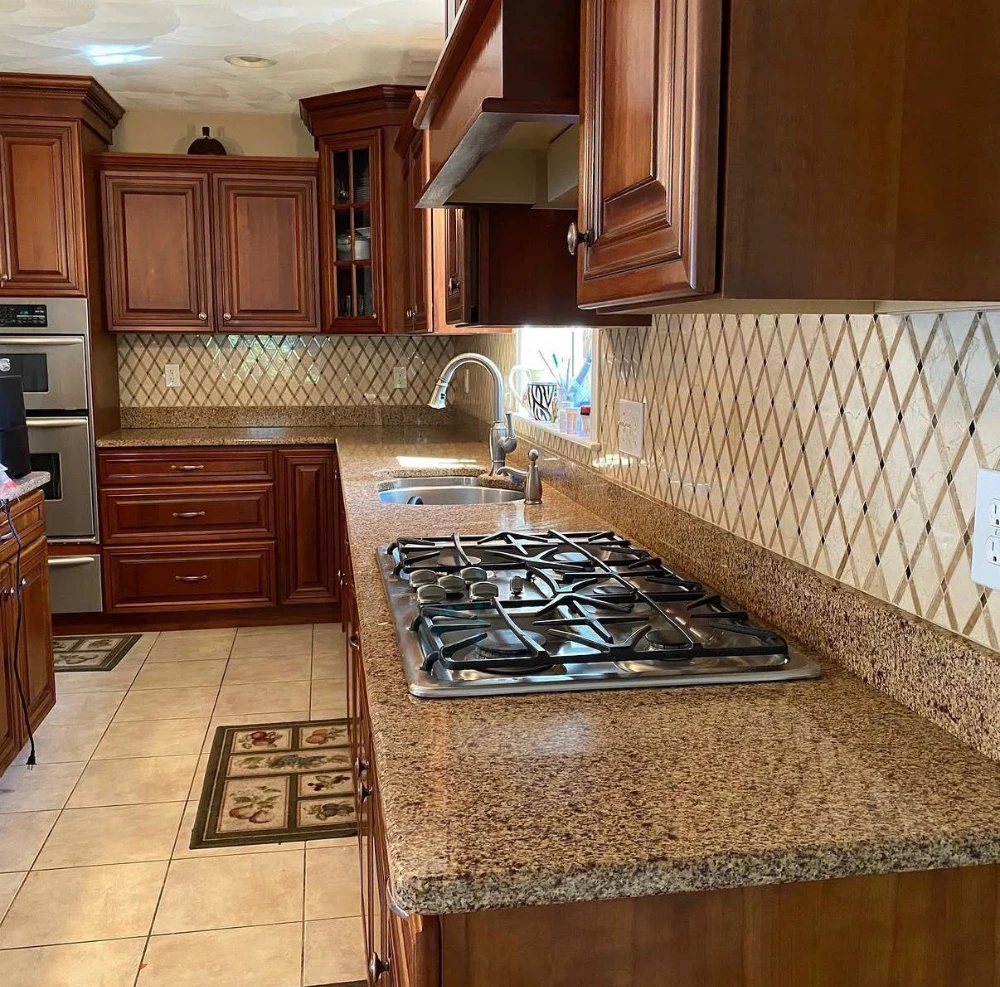 Cherry wood kitchen with granite countertops