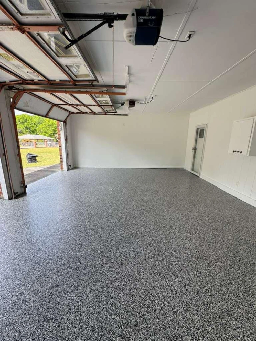 Open garage with freshly installed epoxy flake floor