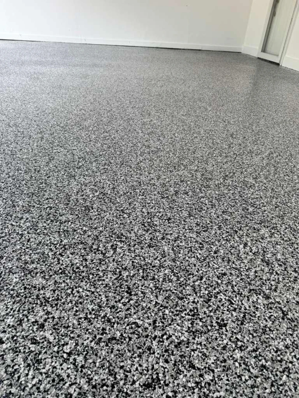 Close-up of gray full-flake epoxy floor finish